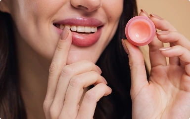 close-up-beauty-portrait-smiling-woman-cares-her-lips-beige-background 1